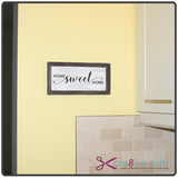 Home Sweet Home sign made of paper hanging in a kitchen