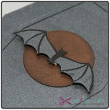 Close-up of vampire bat and moon on 3D paper coffin